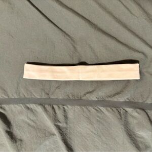 It is a lululemon headband. The color is strawberry milkshake.